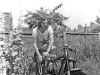 Hornsey  Working on an old BSA Gold Star in the back yard of our house in Hornesy, North London, 1970.  BSA Gold Star